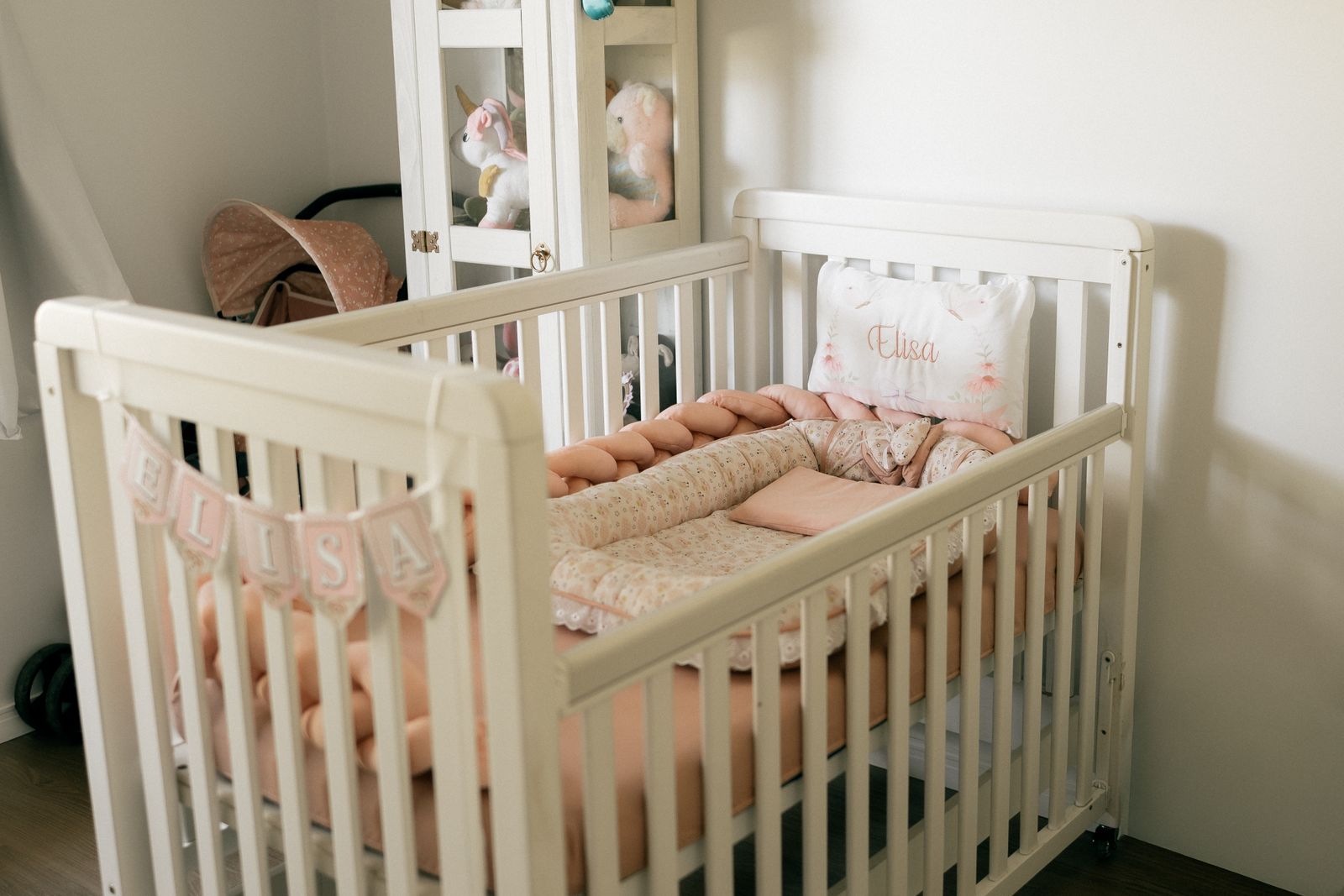 A calm nursery with a white cot