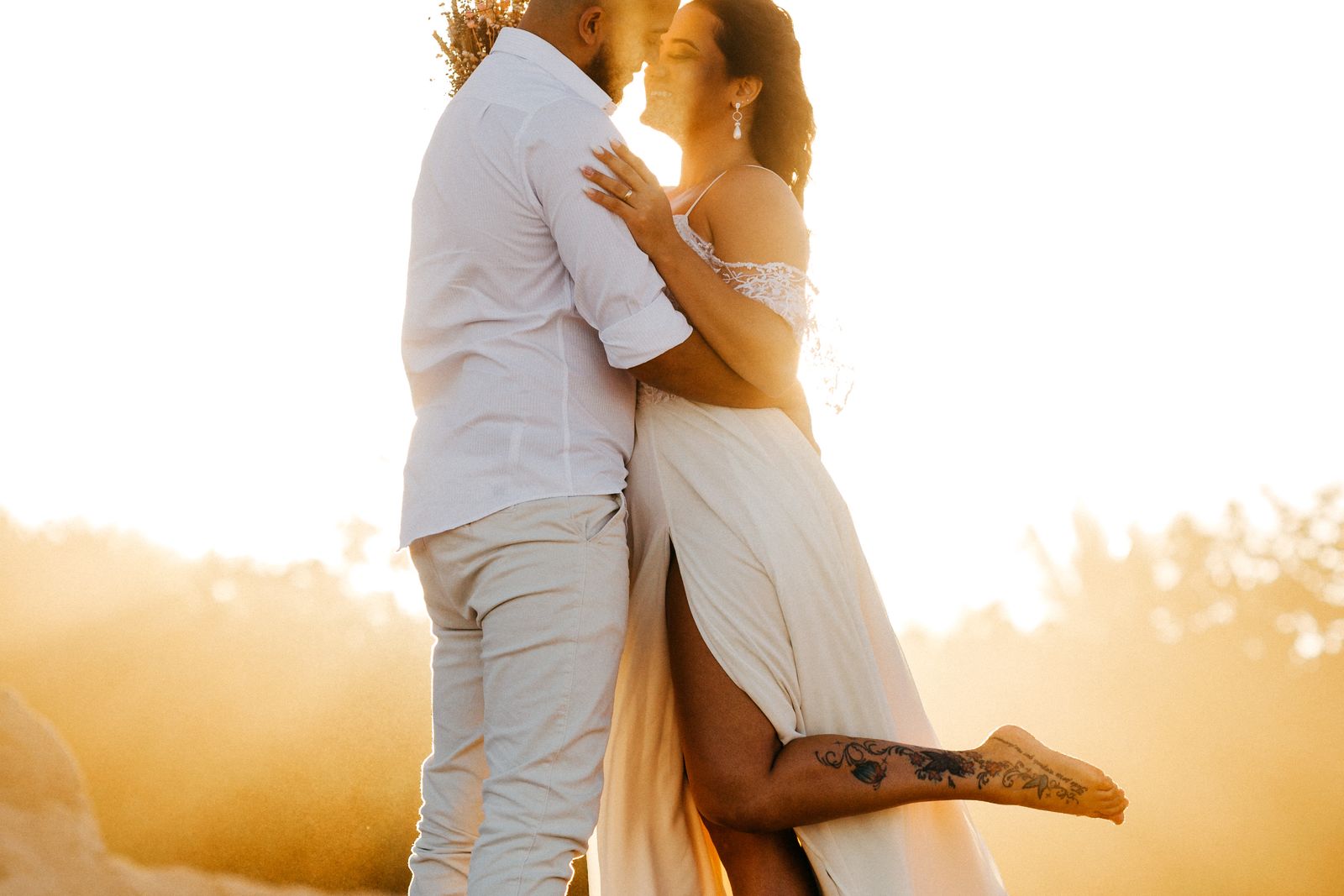 A couple on the beach at golden hour